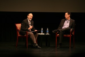 Two men are talking in Tony Kushner and Meeropol Talk Show