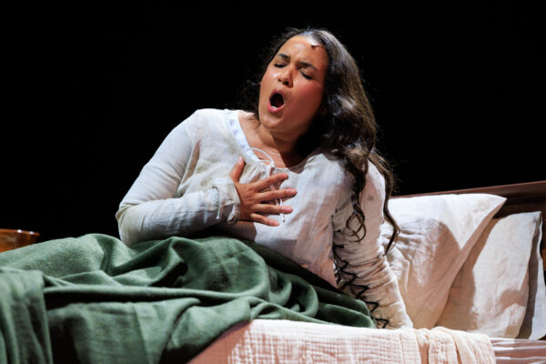 WOMAN IN BED IN ANGUISH